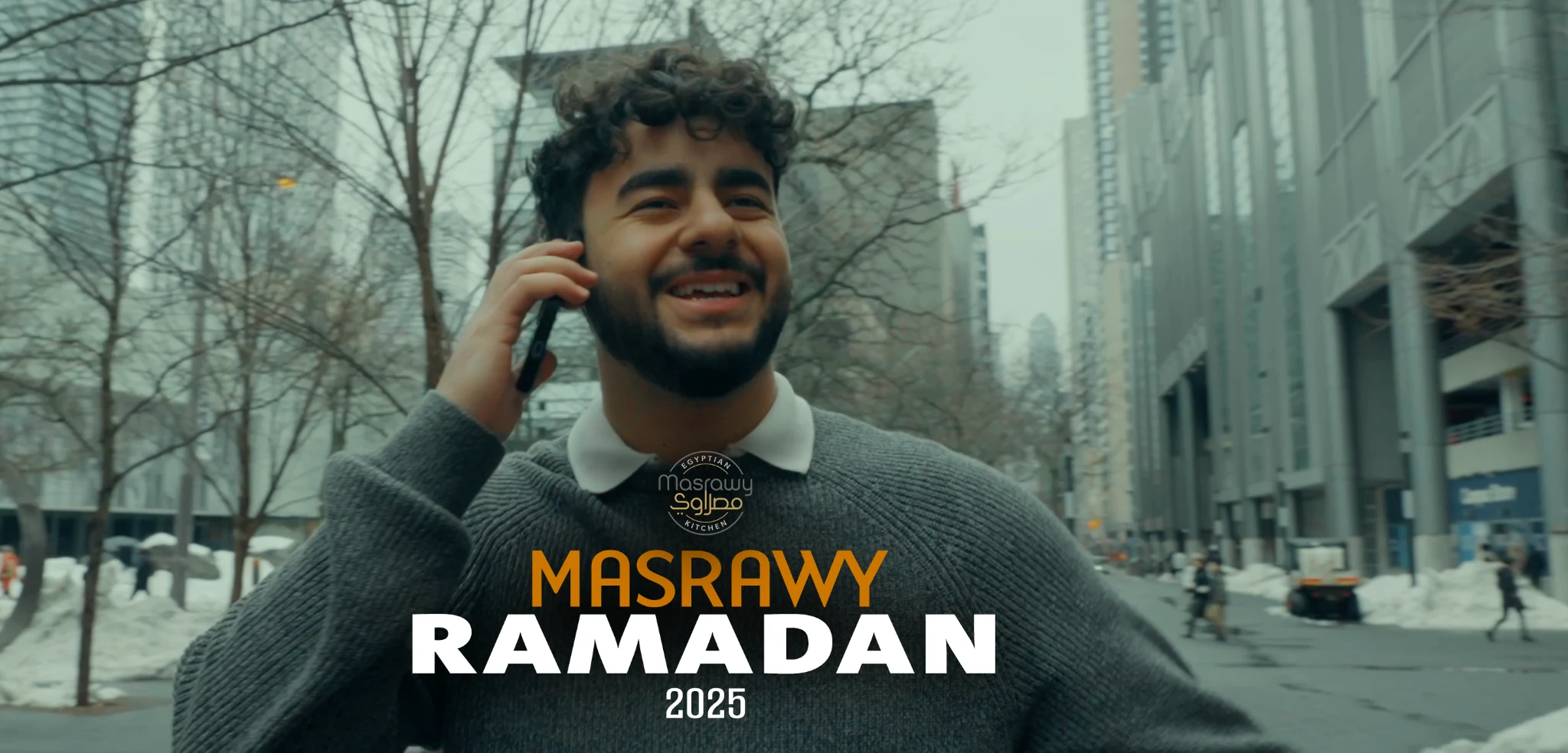 Original Masrawy Ramadan 2025 film cover with a young man taking a phone call on a snowy street